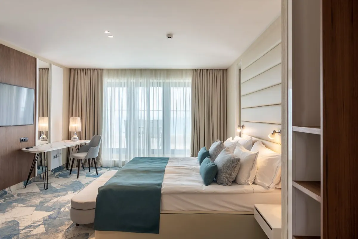 Riu Astoria_Junior Suite_bedroom.jpeg